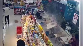 Cement stone smashes into shop after wind blows it off building in China
