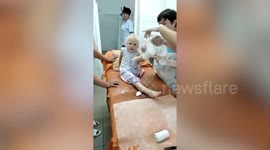 Ukrainian girl injured in Russian shelling sings national anthem while being treated