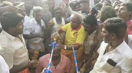Smashing! Indian devotees break coconuts on their heads in plea for health and success