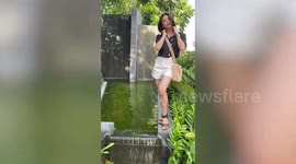 Funny photoshoot fail as preening influencer slips and falls into pool