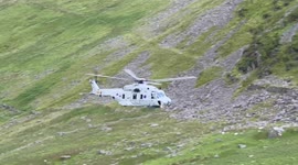 Netherlands Navy helicopter flies low as it navigates Wales' Mach Loop (4K).