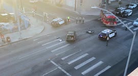 Aftermath of a motorbike crash with a car at sunset in Hollywood with the motorbike rider’s shoes beside the car that hit him