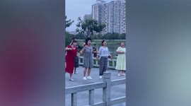 Bizarre moment group of women dance like zombies at park in China