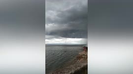 Large thin waterspout forms off Philippines coast before storm