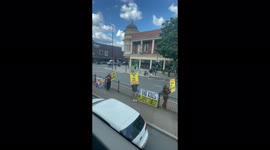 Anti Covid-19 vaccine protesters protest in traffic at Holloway Road north London