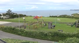 Cornwall Air Ambulance touchs down in the playing fields at the back of Port Isaac North cornwall, England