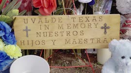 Close-up of a wooden plaque at Robb Elementary in Uvalde, TX. during the vigil