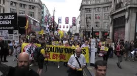 Anti government Bills protesters make their way through Central London on the same day as Pride