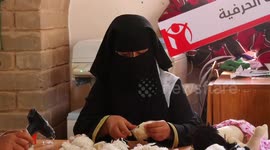 Palestinian women make toy sheep ahead of Eid al-Adha, in the Bedouin village of