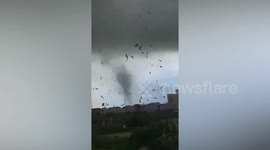 Debris swirls in air as tornado rips through factory in southern China