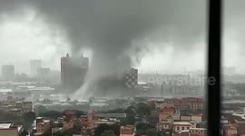 Tornado sweeps through city in southern China, leaving trail of destruction