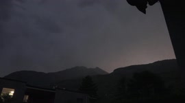 Photographer captures lightning streaking across mountain backdrop in Switzerland