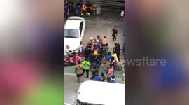 Traffic enforcer, 65, mobbed by angry drivers during clearing operation