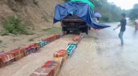 Resistance fighters drive over cases of beer 'owned by Burmese military'