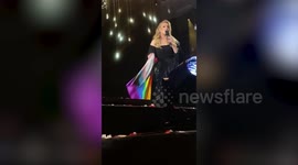 Adele fan bags VIP seats at concert by letting her borrow £8 Pride flag