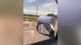 Driver finds water tank 'rolling from nowhere' on bridge in Thailand