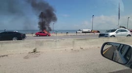 Car spotted in flames on side of south Florida highway
