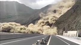 Mud and rock landslide buries highway tunnel on Chinese mountain road