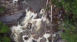 Raging floods wash away car trying to cross creek after torrential rain in southern Thailand