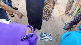 Angry villagers trample on Burmese autocrat's photos on his birthday