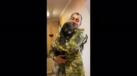 Adorable moment dog trembles with excitement after being reunited with Ukrainian soldier