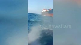 Massive cargo ship crashes into small wooden fishing boat in Indonesia