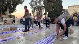 Palestinian Muslims participate in iftar the evening (breaking fast) meal at al-Aqsa mosque compound