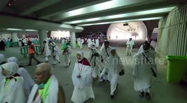 Muslim worshippers cast stones as part of a symbolic stoning of the devil ritual, during the Hajj pilgrimage in Mina, near Saudi Arabia's holy city of Mecca