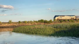 Passenger Train Crossing the Nonesuch River in Maine
