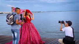 Spectacular bride in red dress captures public attention in Greece