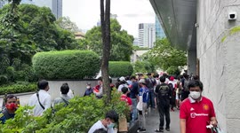 Manchester United fans wait outside team hotel in Bangkok, Thailand
