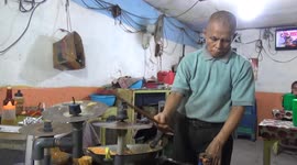creative!! the fried rice seller cooks while playing music and rocking