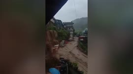 Flash flood cascades through homes in the Philippines