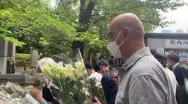 People bring flowers to Shinzo Abe's funeral in Tokyo, Japan