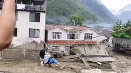 Firefighters rescue residents trapped in flooded houses in southern China