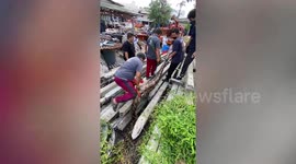 Massive 22ft-long python with TWO dogs in its stomach caught in wasteland in Thailand