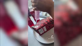 Friends sneak alcohol into festival by SYRINGING pink gin into a cranberry juice