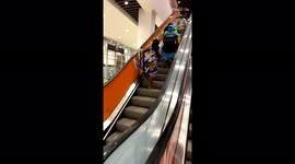 Amusing moment four shoppers in Cameroon encounter escalators for first time