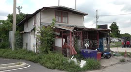 Developers build road around family's home after they refused to leave