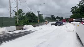Overturned lorry spills tonnes of FLOUR turning entire road white