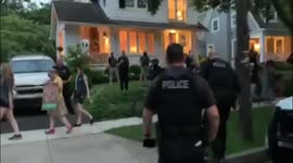 Police stand outside Supreme Court Justice Brett Kavanaugh’s house with a decibel meter after warning pro-abortion rights protesters to keep quiet