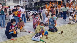 Orange candle wax sculptures paraded during festival in northeast Thailand