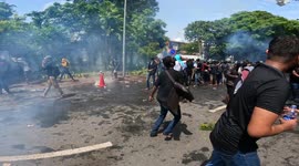 President resigns after chaotic scenes as Sri Lankan students clash with police and toss tear gas back during protest