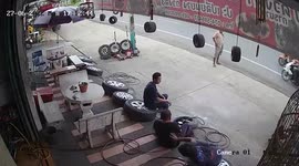 Tyre sparks panic after suddenly exploding while being inflated at mechanic's shop