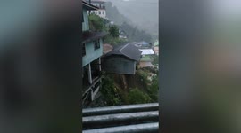 House left teetering on hillside as flash floods erode foundation during storm in the Philippines