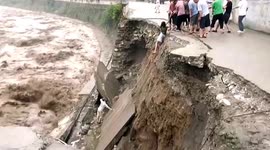 Residents rescued after road collapses under them in China