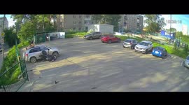 Biker in Russia flips onto car roof after crashing into parked vehicle