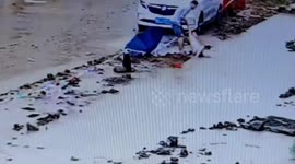Chinese man rescues boy struggling in deep puddle