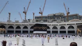 Muslims worshipper pilgrims perform Friday prayer around the Kaaba, Islam's holiest shrine, at the Grand mosque in the holy Saudi city of Mecca