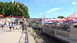 Londoners enjoy sun and food on deck of floating restaurant Peggy Jean